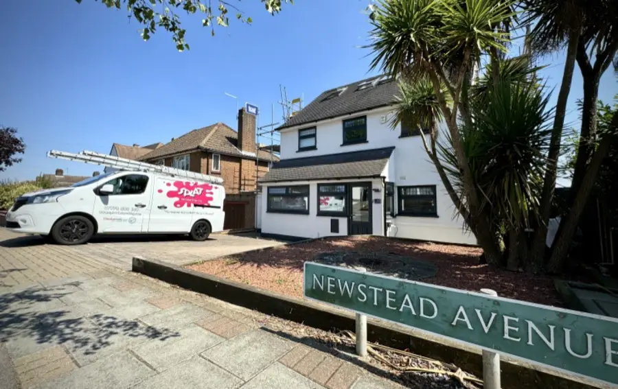 House in Orpington with freshly painted white pebbledash and a Splat Decorating van outside